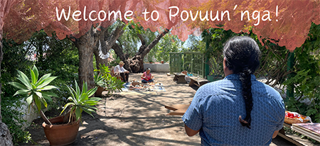 Welcome to Povuun'nga sign over image of the Jacaranda Walk at RLA